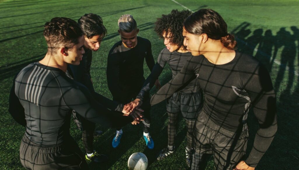 football team shaking hands