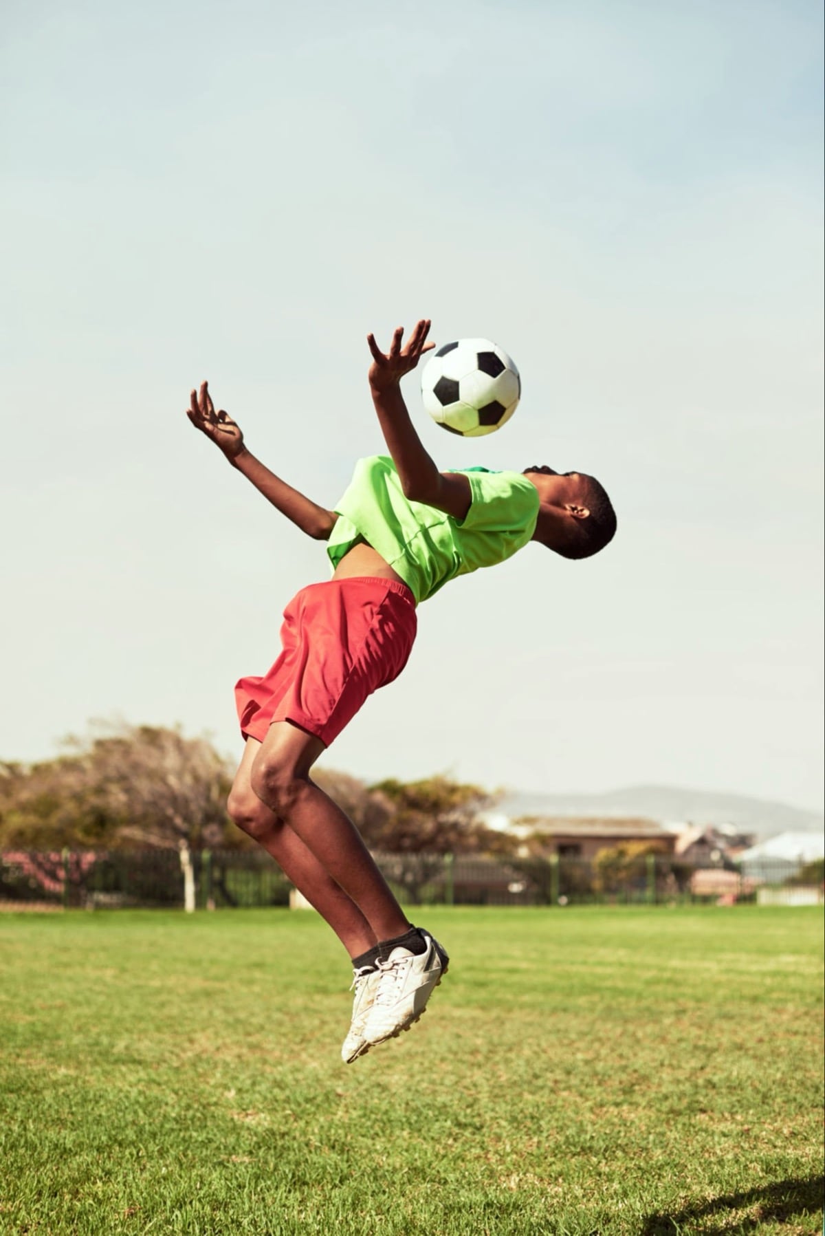 young man showing great skill with a soccer ball